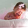 baby, infant, crying, pink, bow, tutu, pillow, soft, cute, closeup, expression, newborn, child, skin, hair, indoors, portrait, emotion, tulle, adorable