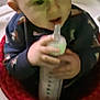 Liam joined the competition — help win amazing prizes! baby, bottle, walker, child, toy, feeding, infant, hand, sitting, face, clothing, indoor, young_child, feeding_bottle, play_area, person, holding, cute, seat, carpet