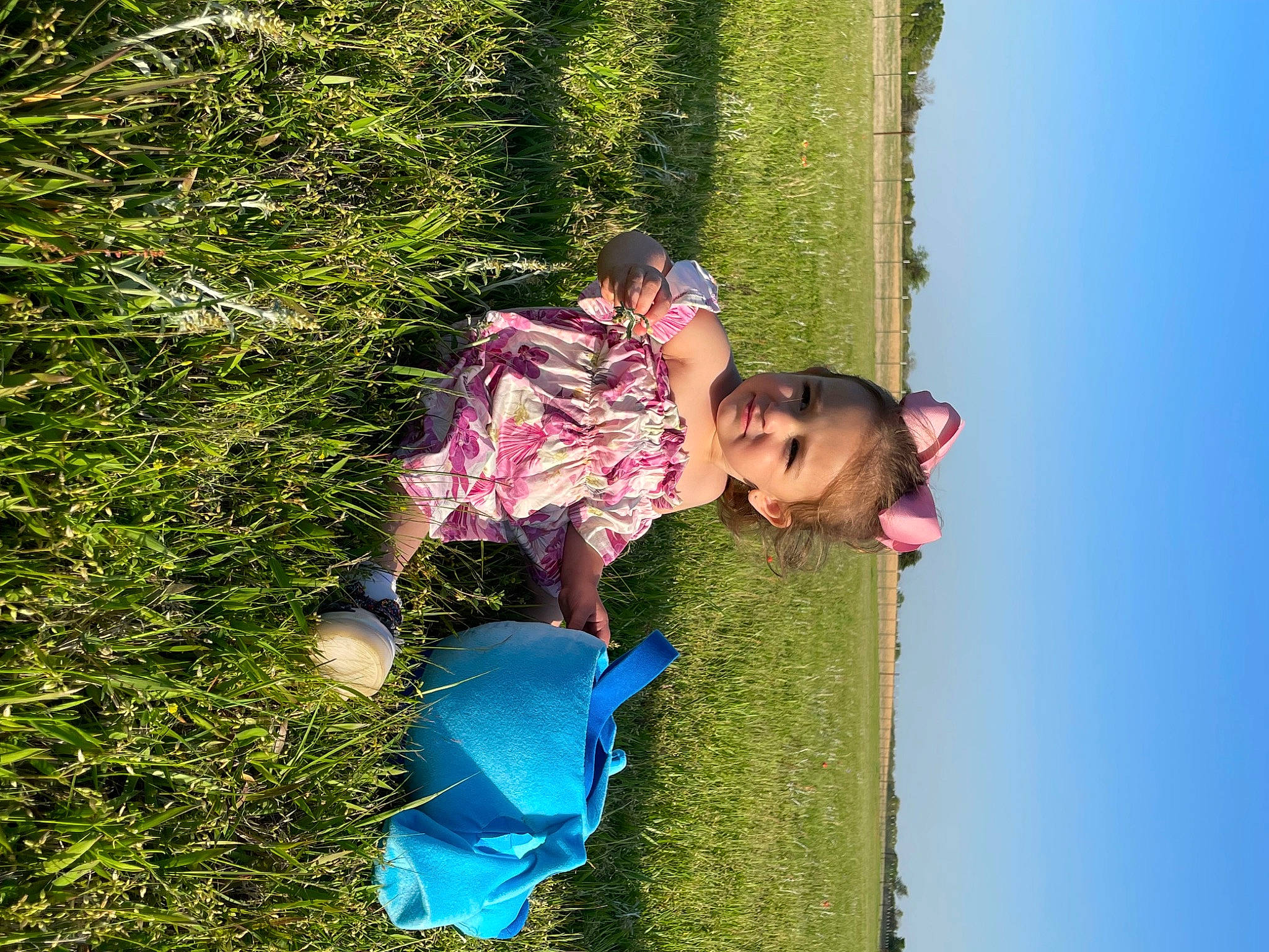 Juvia is registered to the contest to win money with this photo: baby_toddler_clothing, child, electric_blue, fun, grass, grass_family, grassland, groundcover, happy, leisure, people_in_nature, person, plant, play, recreation, shadow, shrub, sky, tints_and_shades, toddler