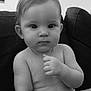 Inaya a rejoint le concours — aidez-le/la à gagner de superbes lots ! baby, black_and_white, child, closeup, couch, cute, diaper, expression, face, hair, hand, indoor, infant, monochrome, person, portrait, sitting, skin, sofa, young