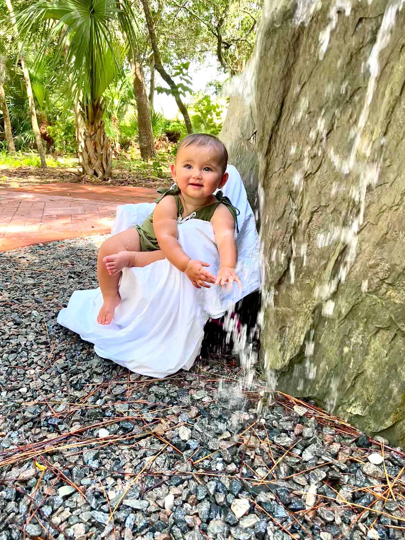 Kimber is registered to the contest to win money with this photo: adaptation, baby, child, dress, eye, facial_expression, fun, grass, happy, joy, landscape, leisure, mammal, people_in_nature, person, plant, recreation, toddler, tree, trunk