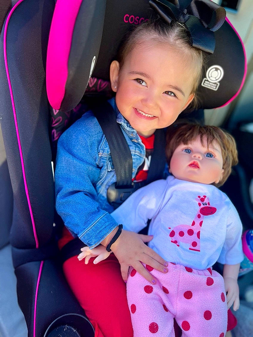 Kimber joined the competition — help win amazing prizes! automotive_design, baby_toddler_clothing, car_seat, child, electric_blue, event, eye, face, facial_expression, fun, hairstyle, happy, head, joy, person, product, skin, smile, snapshot, steering_wheel