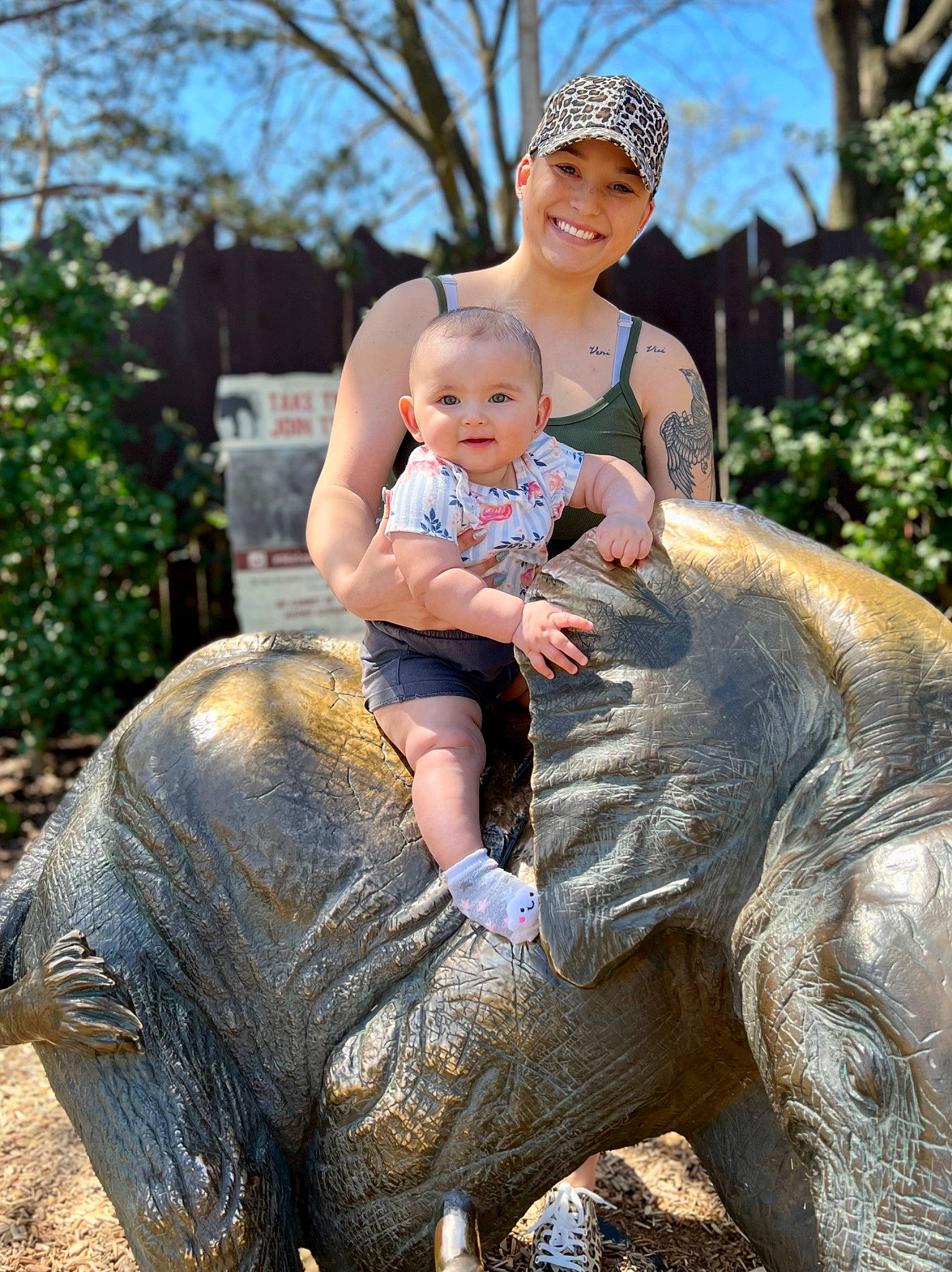 Kimber joined the competition — help win amazing prizes! art, fun, grass, happy, hat, headwear, indian_elephant, interaction, joy, mammal, nature, person, photograph, recreation, sculpture, sky, smile, statue, terrestrial_animal, toddler