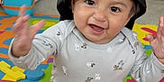 Thiago joined the competition — help win amazing prizes! baby, child, smiling, cap, colorful, foam_mat, indoor, toy, sitting, happy, cute, clothing, sock, playful, young_child, home, floor, person, expression, fun