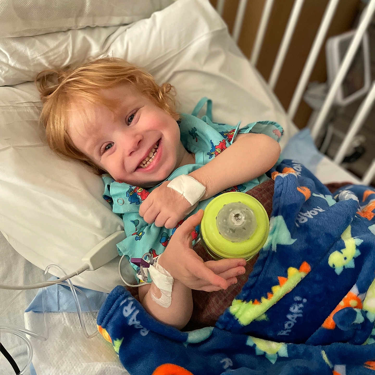 Walker is registered to the contest to win money with this photo: architecture, baby, bed, blanket, bodypart, building, crib, cushion, face, finger, furniture, happy, head, homedecor, hospital, infantbed, person, photography, portrait, smile