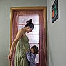 pregnant_woman, child, boy, window, curtains, indoor, home, love, family, affection, dress, shirt, standing, interaction, people, portrait, bond, light, cozy, decor