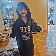 Roman joined the competition — help win amazing prizes! child, smiling, hoodie, big_brother, barefoot, indoors, wooden_floor, blanket, room, curtains, furniture, box, happy, person, casual, clothing, home, floor, portrait, young