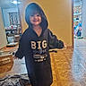 child, smiling, hoodie, big_brother, barefoot, indoors, wooden_floor, blanket, room, curtains, furniture, box, happy, person, casual, clothing, home, floor, portrait, young
