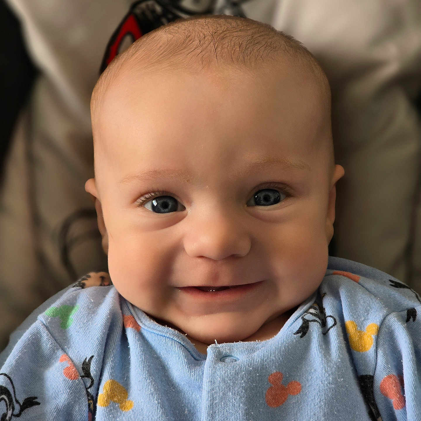 Lennox is registered to the contest to win money with this photo: applique, baby, bodypart, clothing, face, finger, hand, happy, head, knitwear, longsleeve, mouth, newborn, pattern, person, photography, portrait, sleeve, smile, sweater