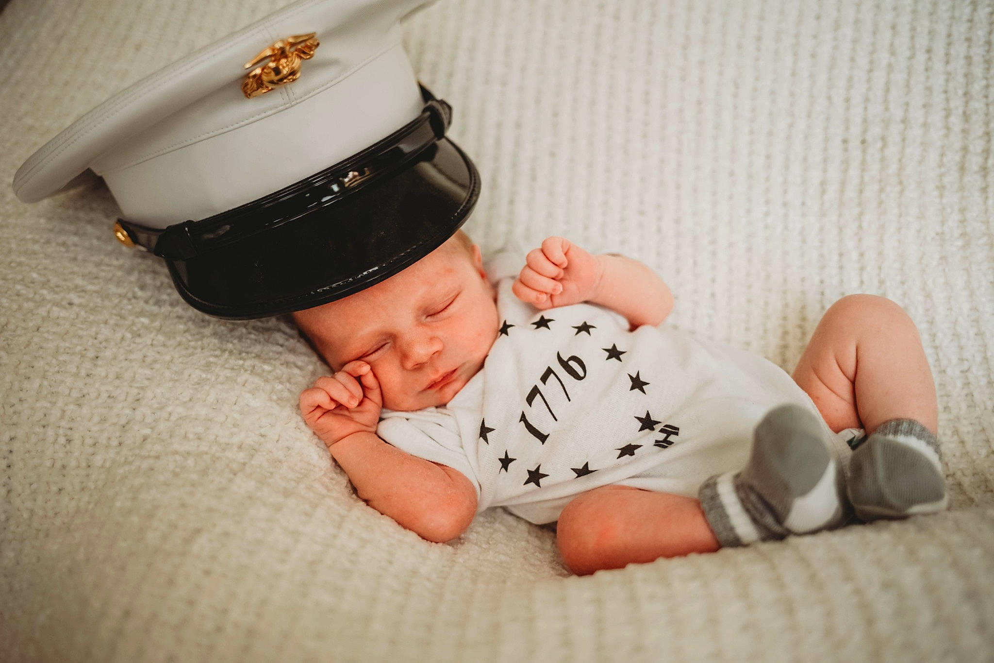 Robby is registered to the contest to win money with this photo: baby, baby_toddler_clothing, cap, collar, comfort, costume_hat, finger, font, foot, happy, hat, headgear, headwear, human_body, jewellery, pattern, person, sitting, sleeve, sun_hat
