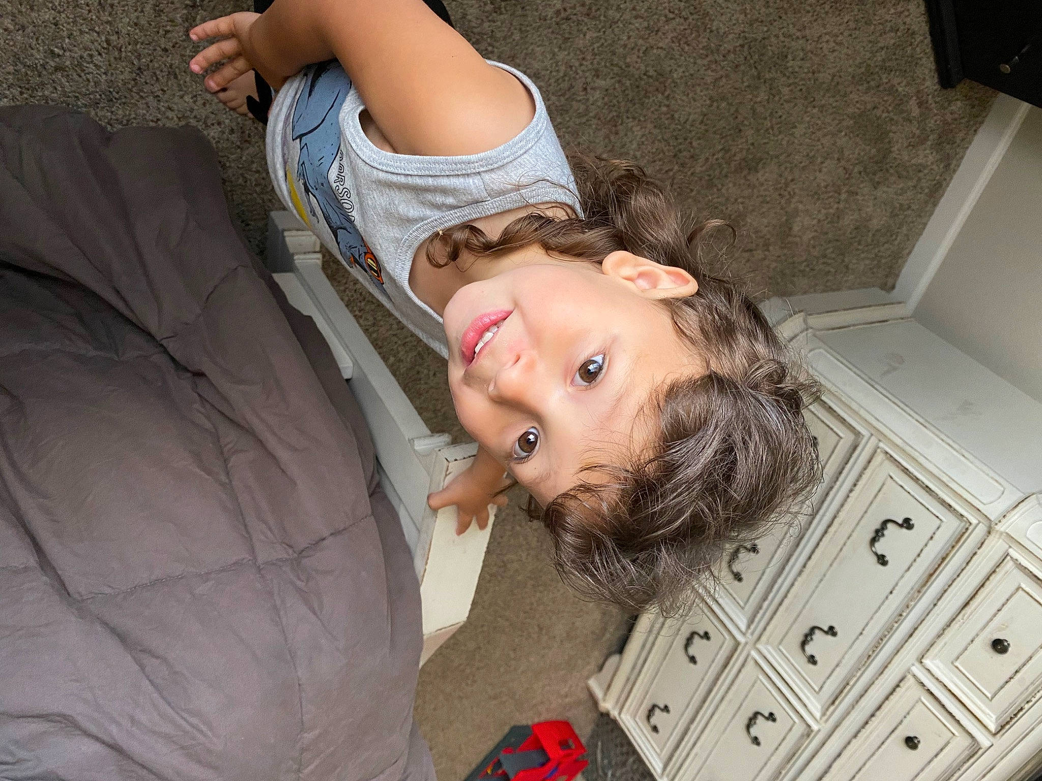 Adrian is registered to the contest to win money with this photo: blond, child, comfort, drawer, flooring, fun, grass, happy, human_leg, leg, leisure, long_hair, mouth, person, room, sitting, textile, thigh, toddler, tree