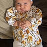 Maelani joined the competition — help win amazing prizes! adorable, baby, bed, blanket, bow, child, cozy, cute, expression, floral_clothing, hands_clasped, headband, indoors, infant, lying_down, person, portrait, soft_lighting, white_tights, young_child