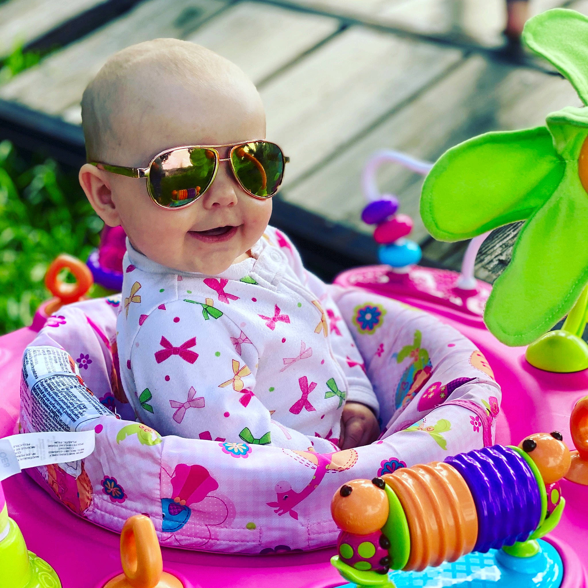Jaycie is registered to the contest to win money with this photo: baby, child, cool, ear, eyewear, glasses, outerwear, person, pink, play, product, recreation, sunglasses, toddler, toy, vision_care