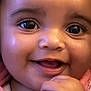 baby, close_up, face, smile, cheeks, eyes, hand, pink_clothing, infant, cute, happy, skin, portrait, child, young, expression, adorable, human, cute_face, baby_face