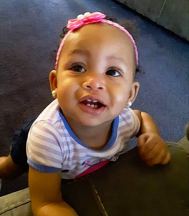 Maiya is registered to the contest to win money with this photo: baby, cheek, child, chin, ear, face, facial_expression, forehead, fun, hair_accessory, happy, head, laugh, lip, mouth, nose, person, skin, smile, toddler