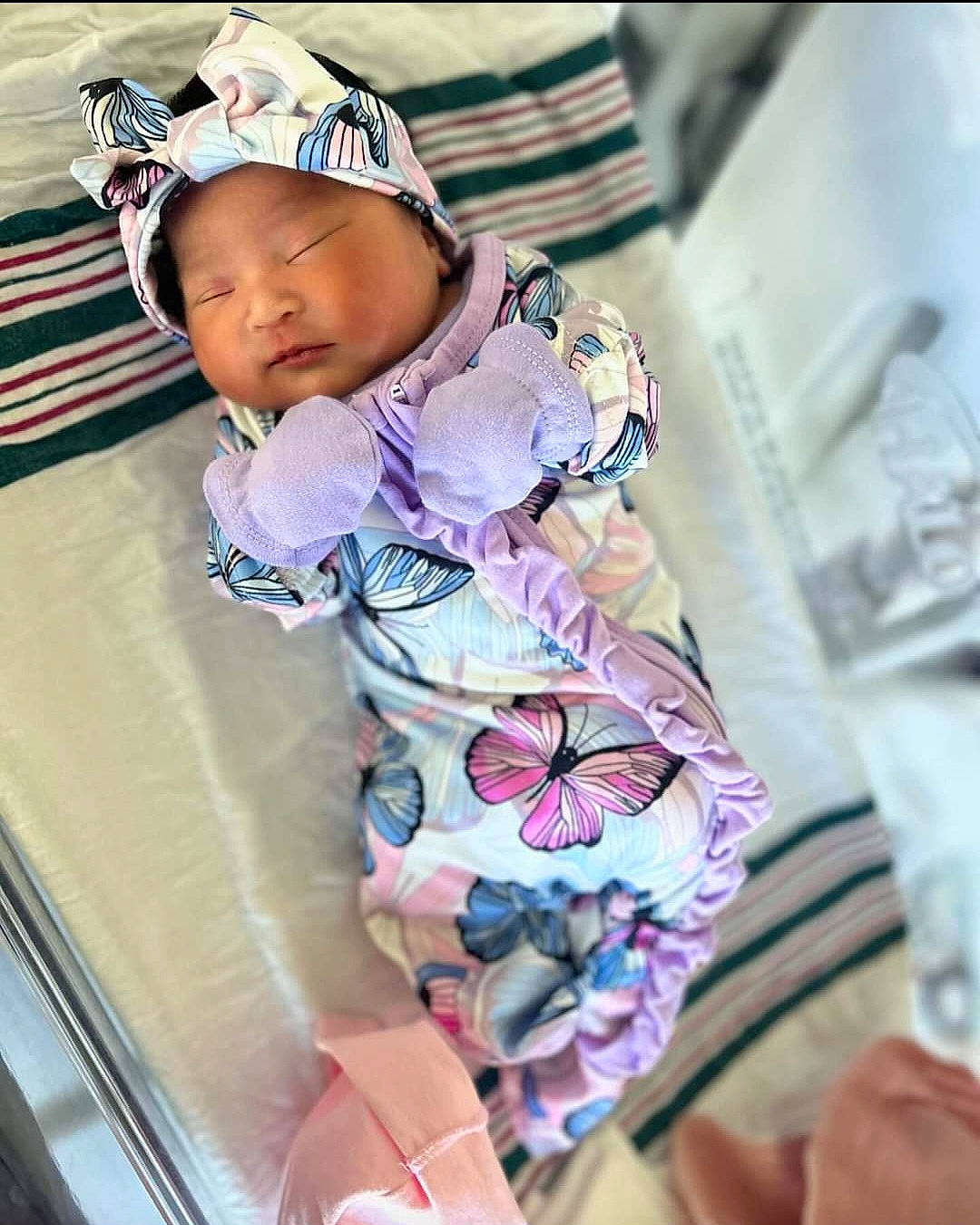 Eliana Luna Arroyo is registered to the contest to win money with this photo: baby, baby_toddler_clothing, cap, child, comfort, fashion_accessory, happy, headwear, human_leg, knee, linens, magenta, pattern, person, room, sitting, sleeve, t_shirt, textile, thigh