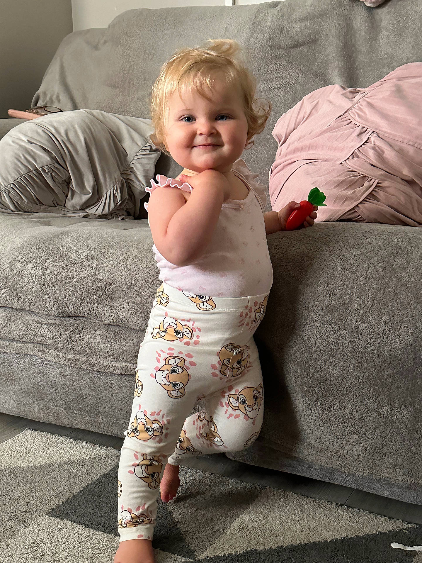 Nala joined the competition — help win amazing prizes! architecture, baby, bodypart, building, clothing, couch, cushion, face, finger, furniture, hand, happy, head, homedecor, pajamas, pants, person, photography, pillow, portrait