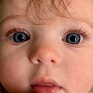 Elizabeth joined the competition — help win amazing prizes! baby, closeup, face, blue_eyes, eyelashes, skin, hair, mouth, nose, infant, child, portrait, cute, expression, young, clothing, zipper, floral_pattern, soft_light, indoors