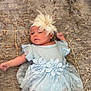 baby, infant, blue_dress, flower_headband, carpet, pattern, cute, lying_down, child, soft_fabric, indoors, peaceful, small_hands, small_feet, adorable, portrait, floor, delicate, resting, curious