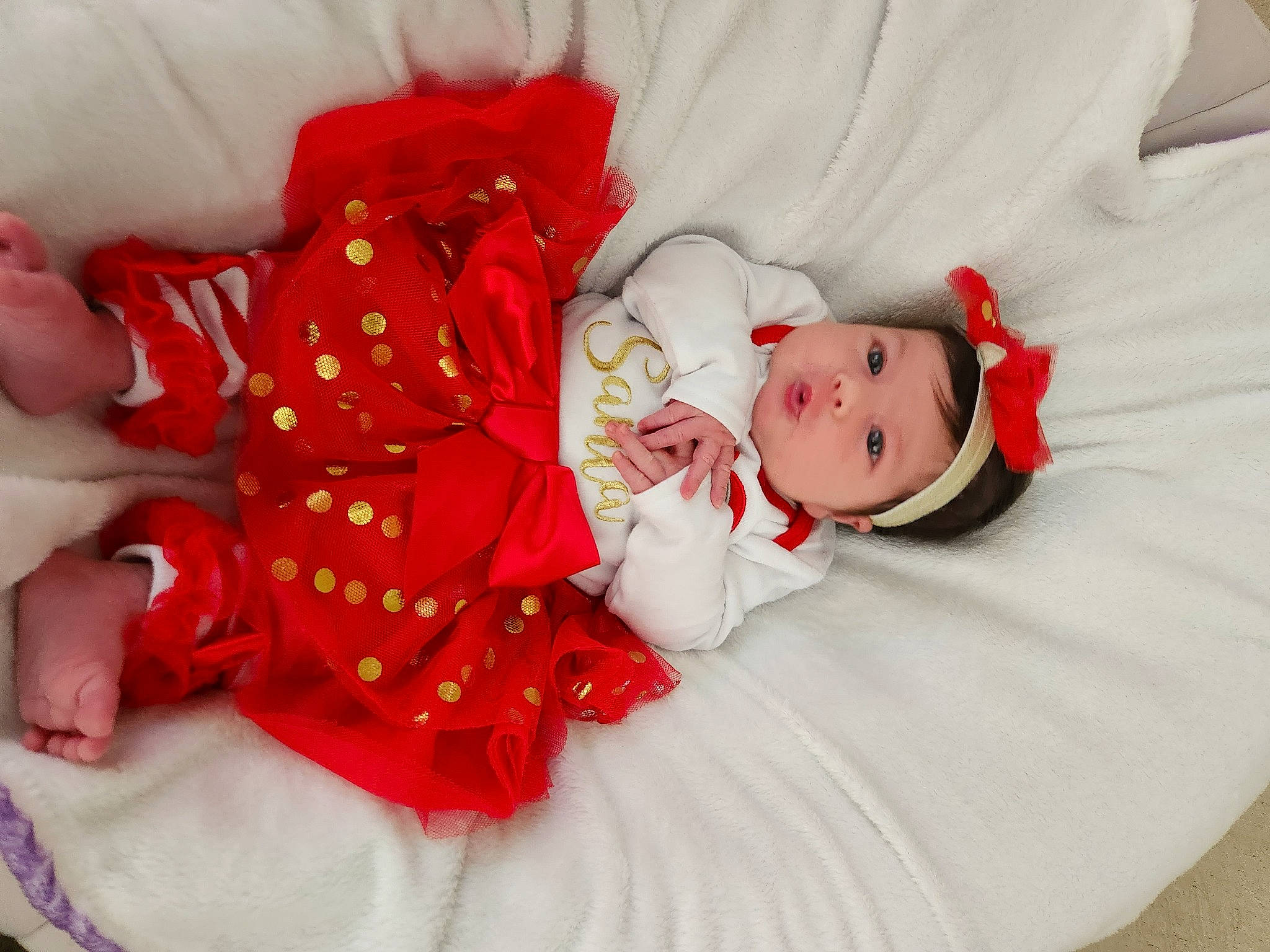 Libby is registered to the contest to win money with this photo: baby, baby_sleeping, baby_toddler_clothing, child, comfort, dress, eye, face, hand, happy, head, headgear, headwear, human_body, leg, linens, person, pink, skin, sleeve