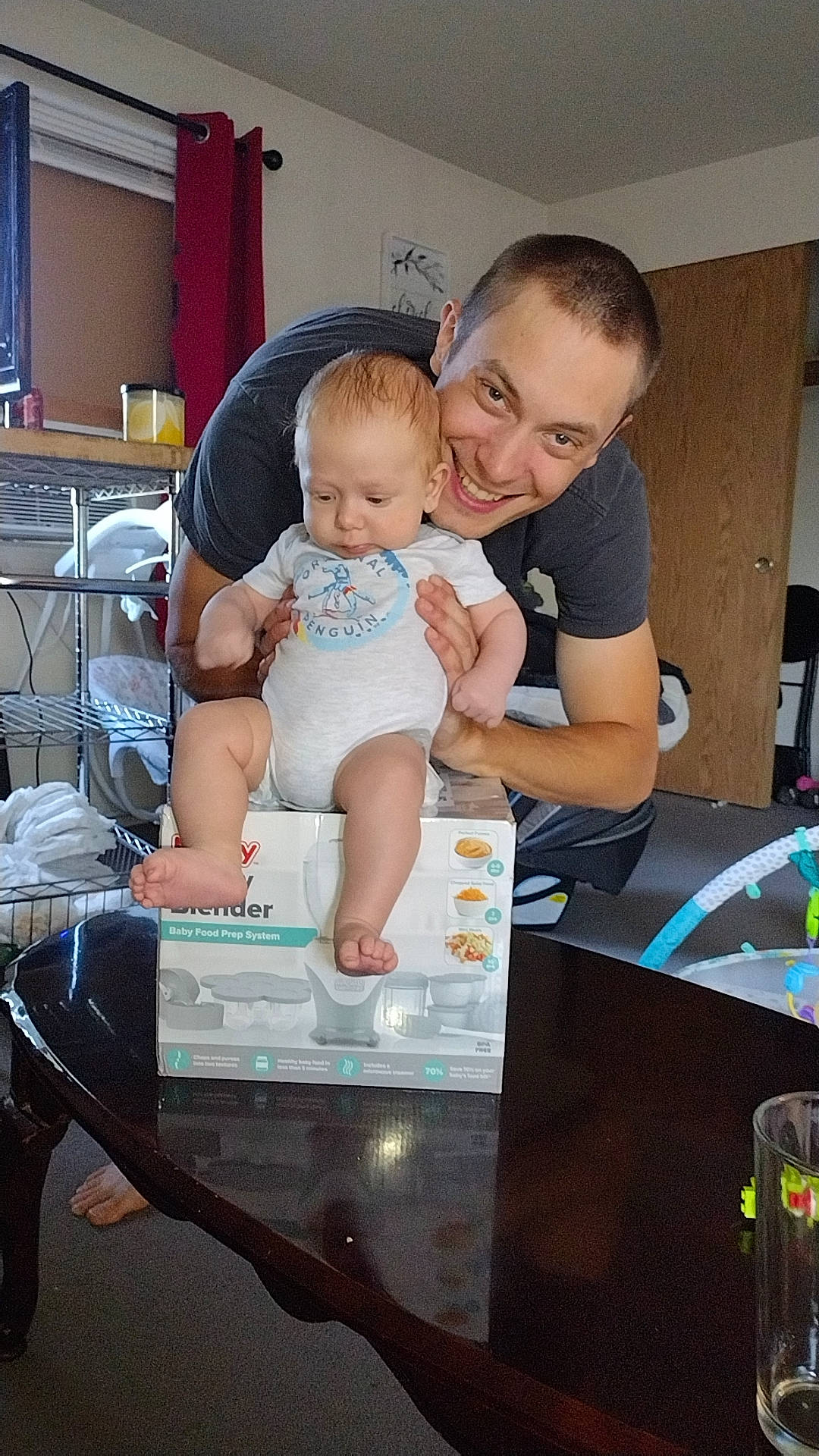 Emmett is registered to the contest to win money with this photo: baby, baby_products, baby_toddler_clothing, child, flash_photography, fun, happy, joy, leisure, person, play, room, sitting, t_shirt, toddler