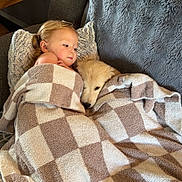 Ramona joined the competition — help win amazing prizes! child, puppy, dog, blanket, snuggling, cozy, chair, plush, indoor, cute, relaxing, furniture, pet, young_child, comfort, warm, sleepy, resting, home, companionship