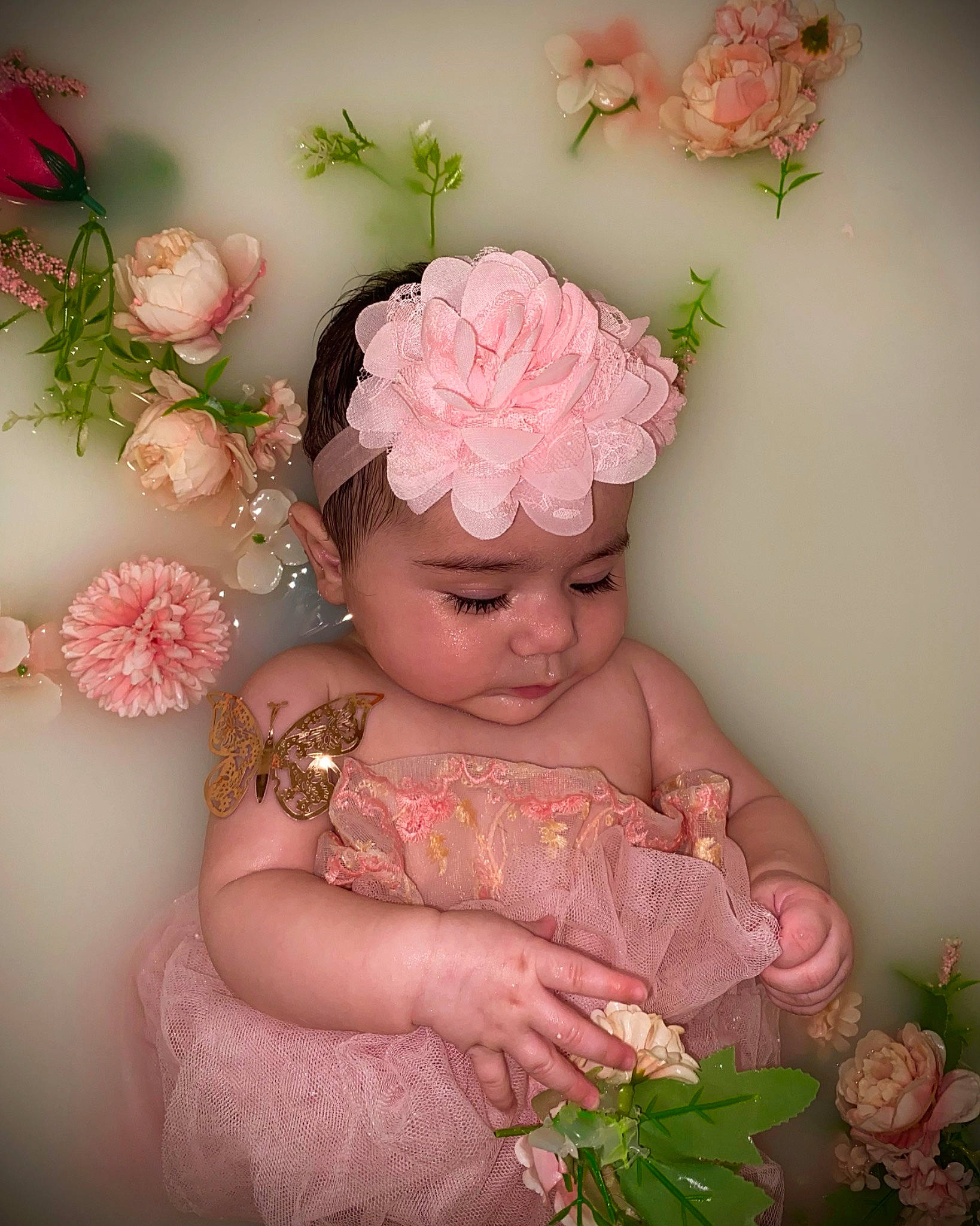 Analisse is registered to the contest to win money with this photo: artificial_flower, baby, baby_toddler_clothing, child, cut_flowers, embellishment, fashion_accessory, floral_design, flower, flower_arranging, hair_accessory, happy, headpiece, headwear, peach, person, petal, pink, rose_family, spring