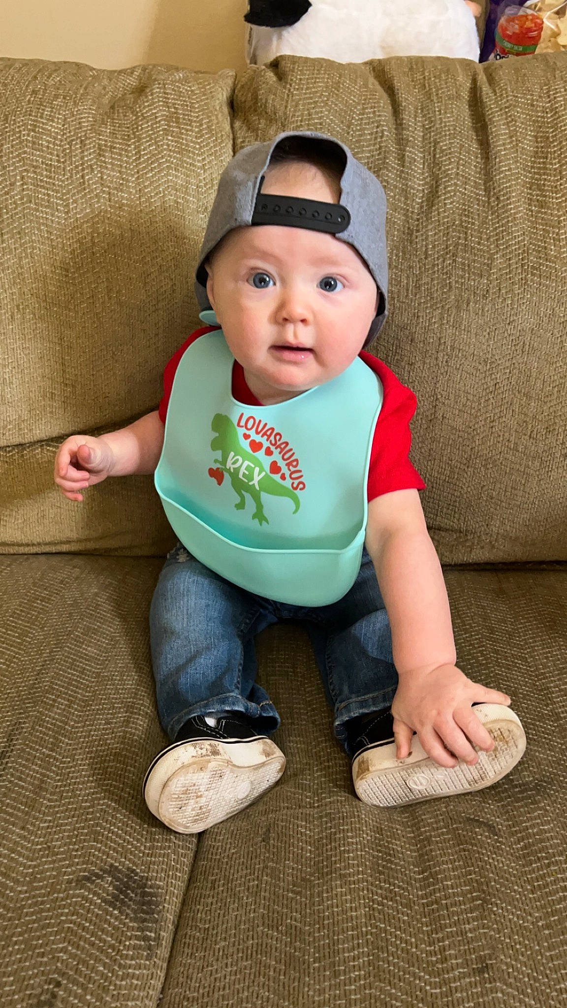 Maddex is registered to the contest to win money with this photo: baby, baby_toddler_clothing, beanie, cap, cheek, child, comfort, costume_hat, eye, foot, hat, headwear, linens, pattern, person, sitting, skin, sleeve, sock, sun_hat