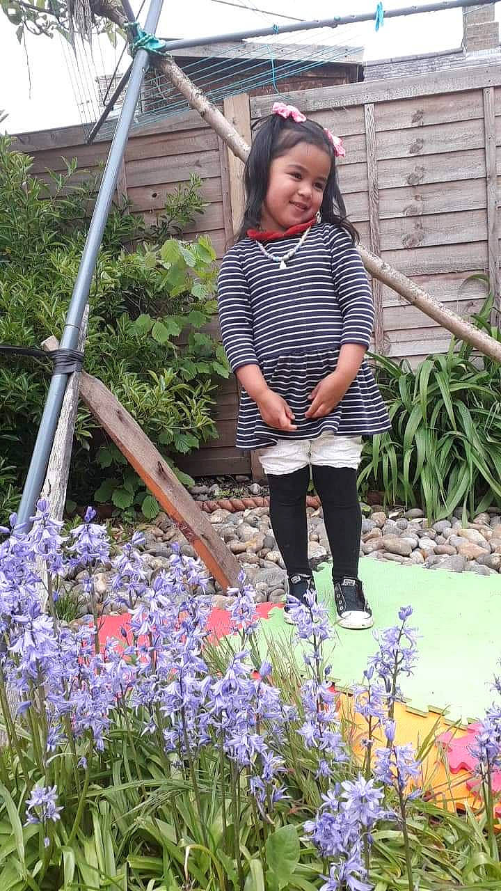 Ate Sissy Chelsea is registered to the contest to win money with this photo: annual_plant, electric_blue, flower, flowering_plant, garden, grass, grass_family, groundcover, joy, landscaping, leisure, organ, pattern, people_in_nature, person, plant, purple, shrub, sleeve, smile