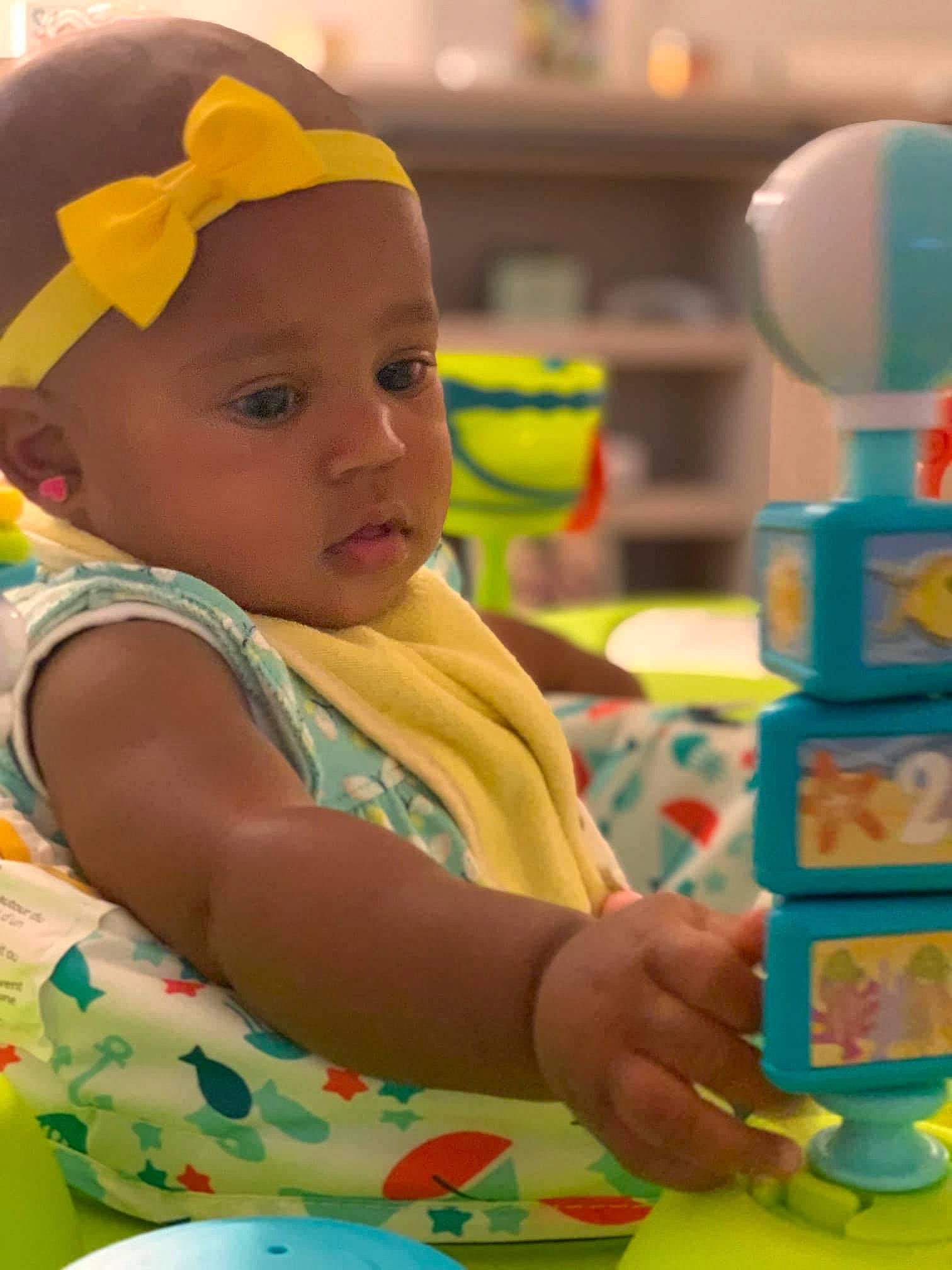 Kayla is registered to the contest to win money with this photo: baby, baby_playing_with_toys, baby_toddler_clothing, cap, child, dishware, event, fun, green, happy, headwear, leisure, person, product, serveware, sharing, summer, tableware, toddler, toy