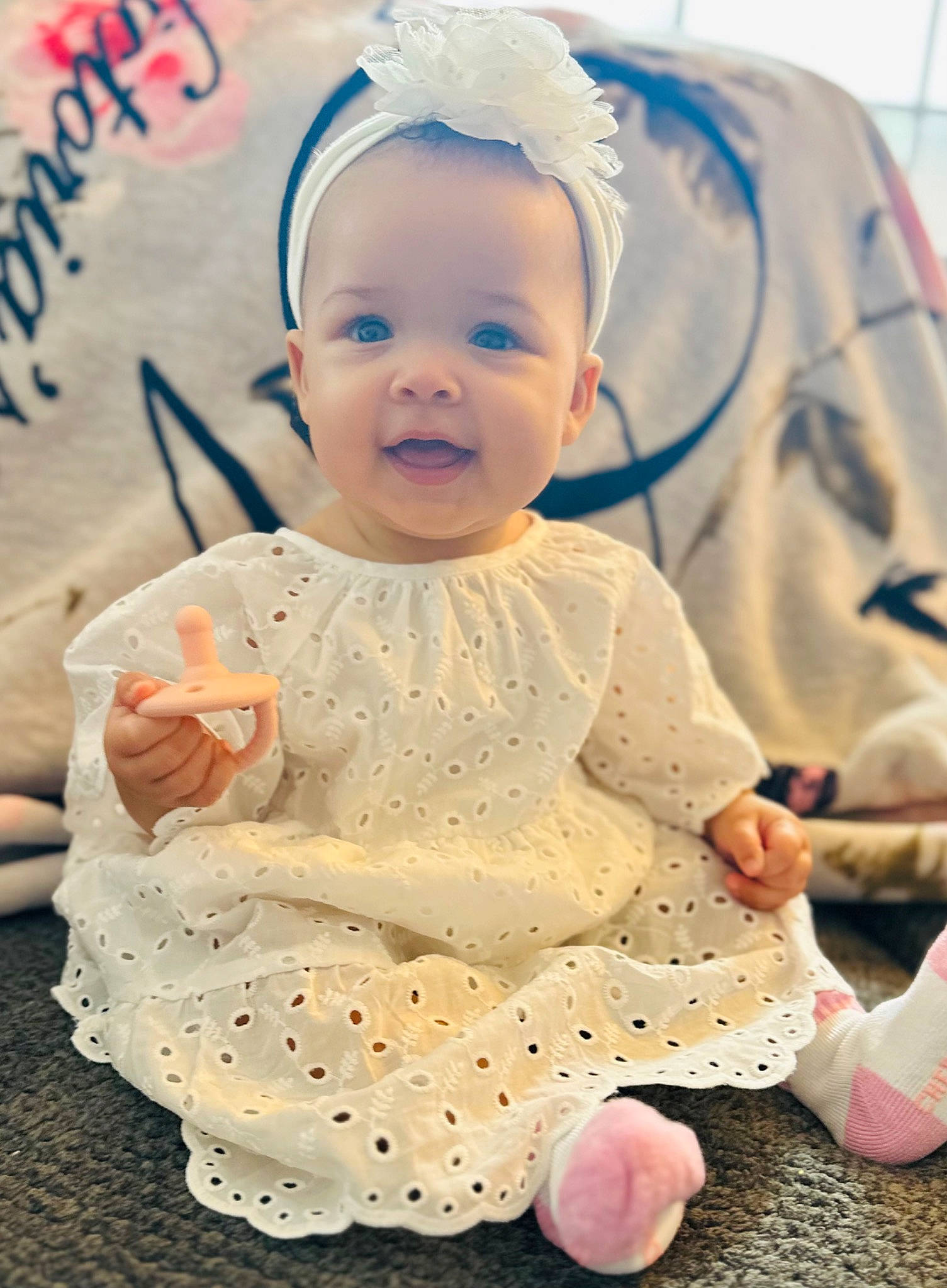 Sariyah joined the competition — help win amazing prizes! baby, baby_products, baby_toddler_clothing, cap, cheek, child, dress, event, fashion_accessory, finger, fun, happy, headgear, headpiece, person, pink, sitting, skin, smile, toddler