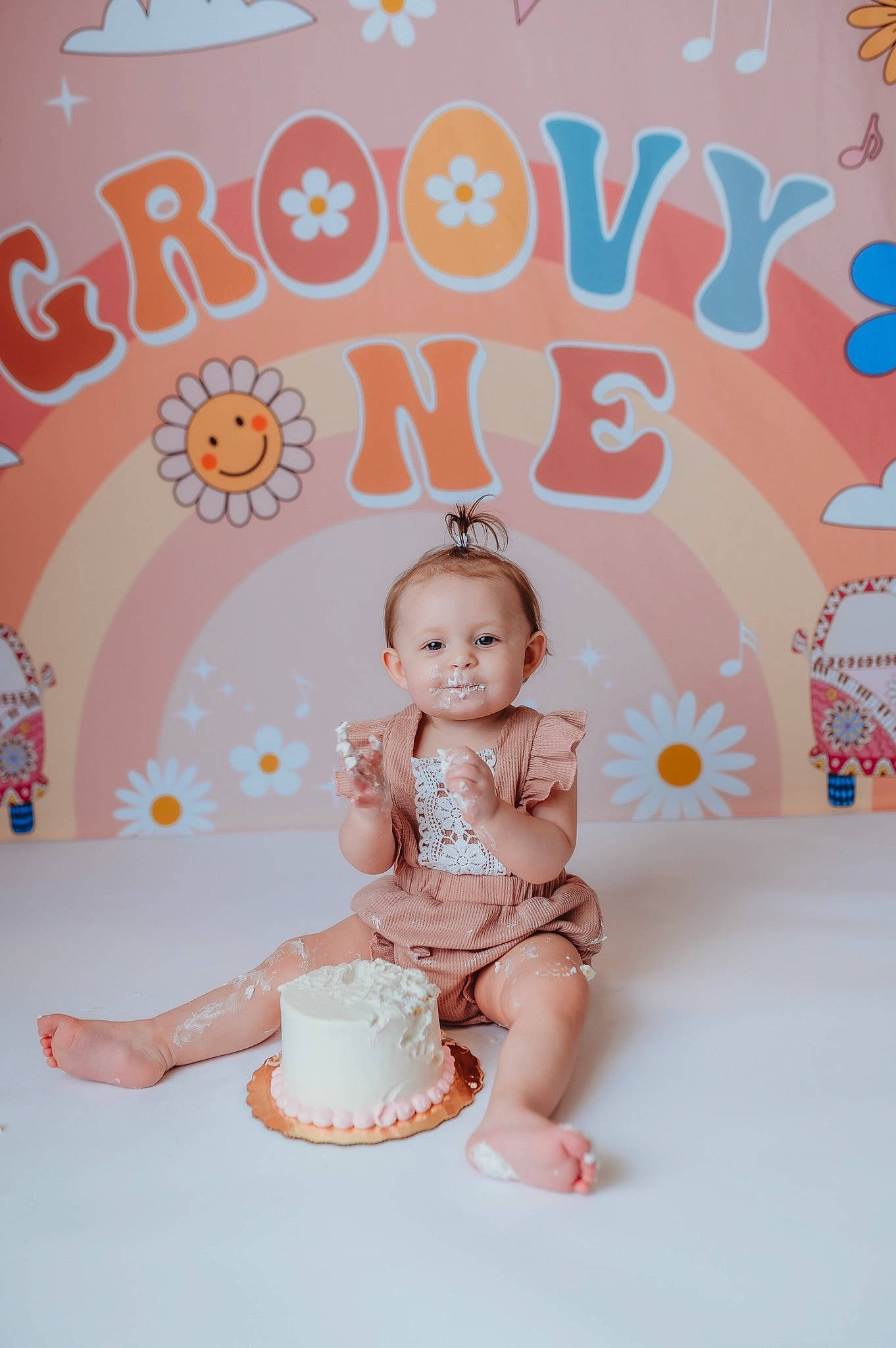 Alison is registered to the contest to win money with this photo: baby, baby_products, baby_toddler_clothing, child, design, font, happy, icing, magenta, party_supply, pattern, peach, person, pink, product, sitting, smile, sugar_cake, sweetness, textile