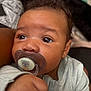 Jai Ceon is registered to the contest to win money with this photo: baby, baby_boy, baby_girl, close_up, clothing, cozy, curious, cute, eyes, face, gray_outfit, hand, indoors, infant, newborn, pacifier, person, portrait, skin, young_child