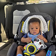 Jai Ceon joined the competition — help win amazing prizes! baby, blue_bib, blue_sock, car_interior, car_seat, child, cute, fabric, head_support, infant, person, plush_toy, raccoon, seat, seat_belt, sitting, sunlight, toy, window, young_child