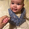 Djayli participe au concours pour gagner de l'argent avec cette photo : baby, infant, child, hand_holding, vest, blue_vest, floral_pattern, smiling, happy, cute, sitting, blanket, cream_clothing, portrait, indoor, closeup, face, skin, person, young
