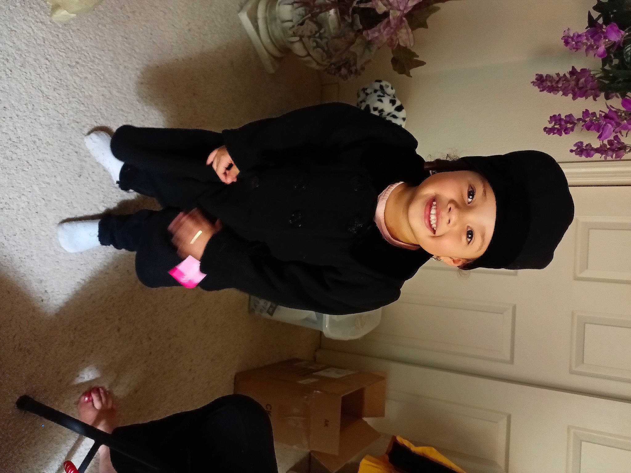 Lyric is registered to the contest to win money with this photo: comfort, elbow, finger, flooring, fun, happy, hat, headwear, houseplant, human_leg, joint, joy, knee, person, plant, room, sitting, smile, thigh, trunk