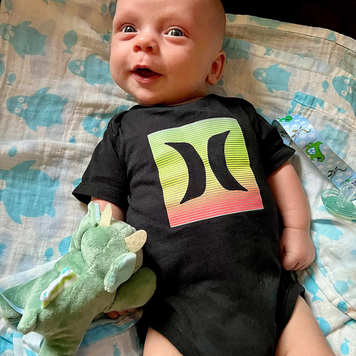 Ryland joined the competition — help win amazing prizes! baby, bed, bedroom, clothing, couch, cushion, diaper, face, furniture, head, homedecor, newborn, person, photography, portrait, quilt, shirt, t_shirt, text, toy