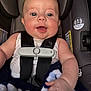 baby, car_seat, child, smiling, blanket, seatbelt, safety, infant, cute, happy, face, expression, indoor, clothing, baby_bottle, child_seat, protection, adorable, person, newborn