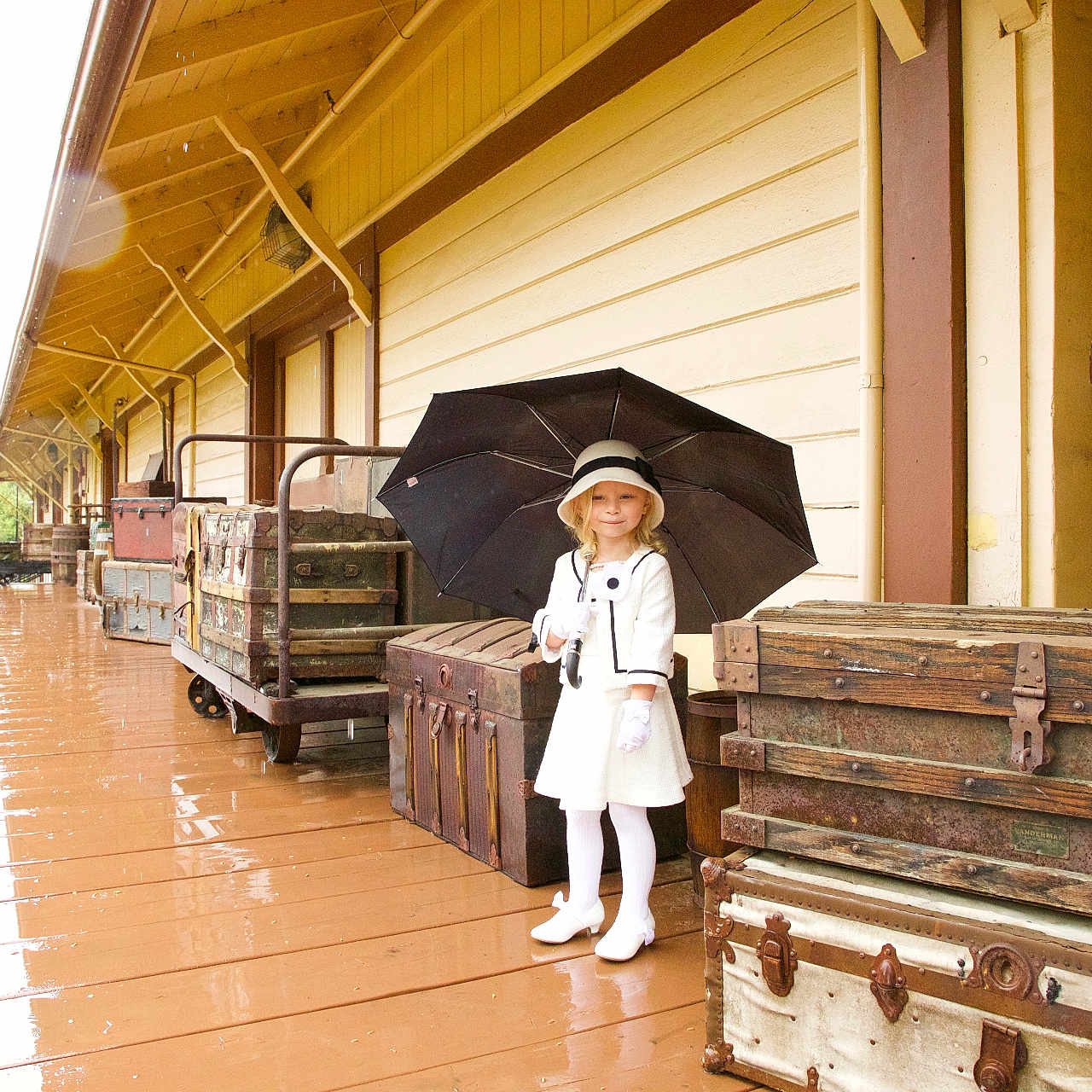 Ysabela is registered to the contest to win money with this photo: architecture, building, child, city, clothing, coat, female, glove, hardwood, house, housing, outdoors, path, porch, road, shelter, street, urban, walkway, wood