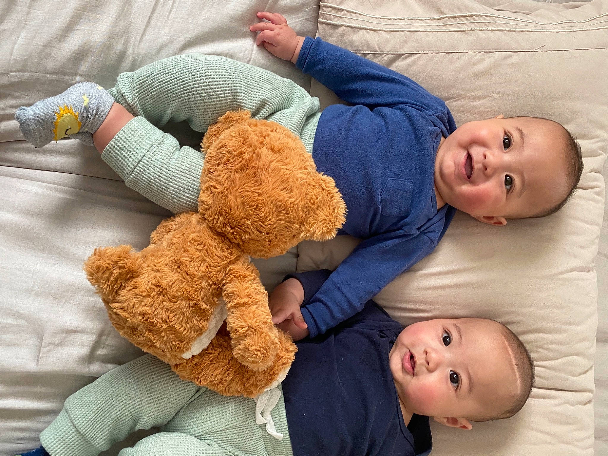 Bjorn is registered to the contest to win money with this photo: arm, baby, baby_sleeping, baby_toddler_clothing, child, comfort, finger, gesture, happy, joy, linens, mammal, organ, people, person, product, skin, smile, stuffed_toy, toddler