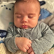 Archer is registered to the contest to win money with this photo: baby, sleeping, infant, hands, blanket, cozy, soft, peaceful, cute, face, closed_eyes, clothing, newborn, portrait, child, skin, indoors, warm, comfort, rest