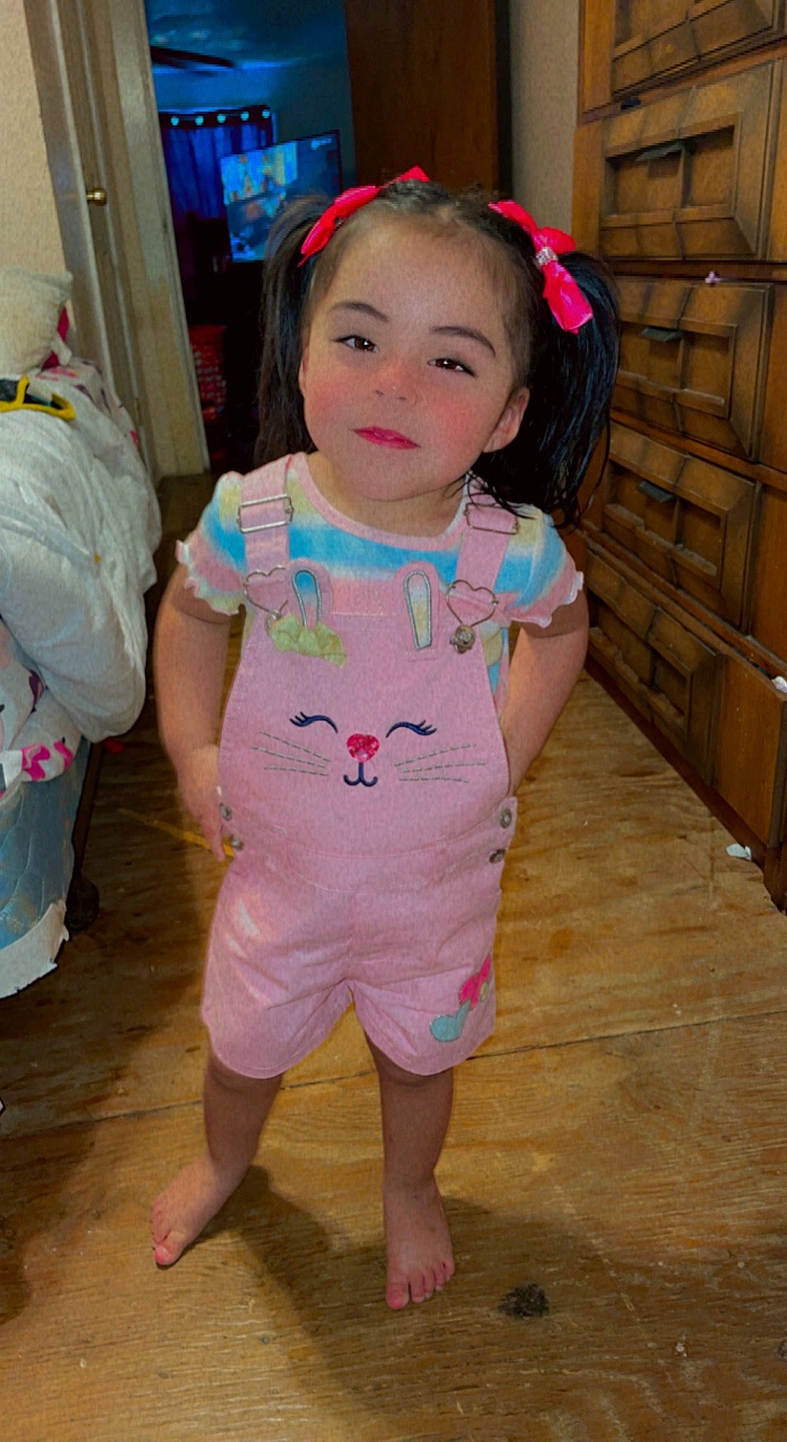 Daniela is registered to the contest to win money with this photo: baby, baby_toddler_clothing, cheek, child, chin, eye, eyelash, face, facial_expression, fun, happy, head, human_body, magenta, person, pink, skin, sleeve, standing, t_shirt