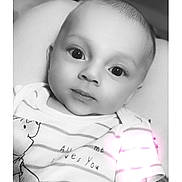 Theodore is registered to the contest to win money with this photo: baby, infant, portrait, black_and_white, face, eyes, clothing, striped_shirt, cartoon, cute, child, newborn, lying_down, soft_lighting, indoors, closeup, person, smile, expression, toddler