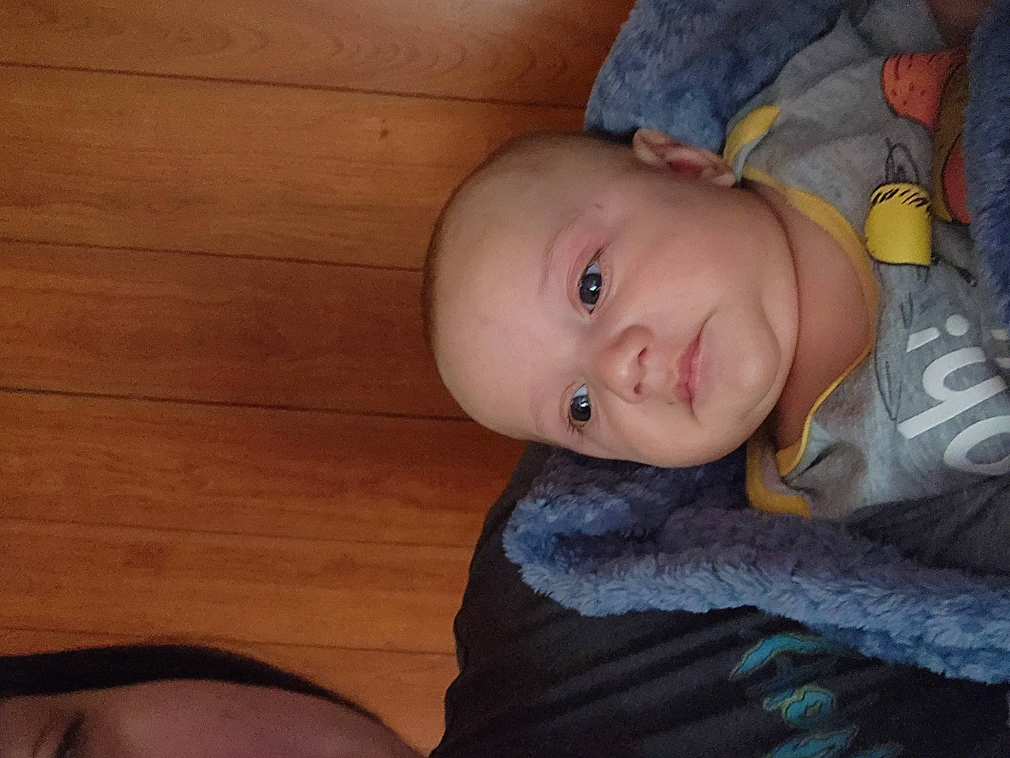 Kayden joined the competition — help win amazing prizes! baby, baby_toddler_clothing, cheek, comfort, electric_blue, eye, flash_photography, fun, hardwood, hat, iris, mouth, nose, person, sitting, skin, sleeve, smile, toddler, wood