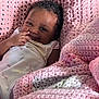 baby, blanket, child, clothing, comfort, cozy, crochet, curly_hair, cute, expression, face, hand, happy, infant, lying_down, pink, portrait, skin, smile, warm