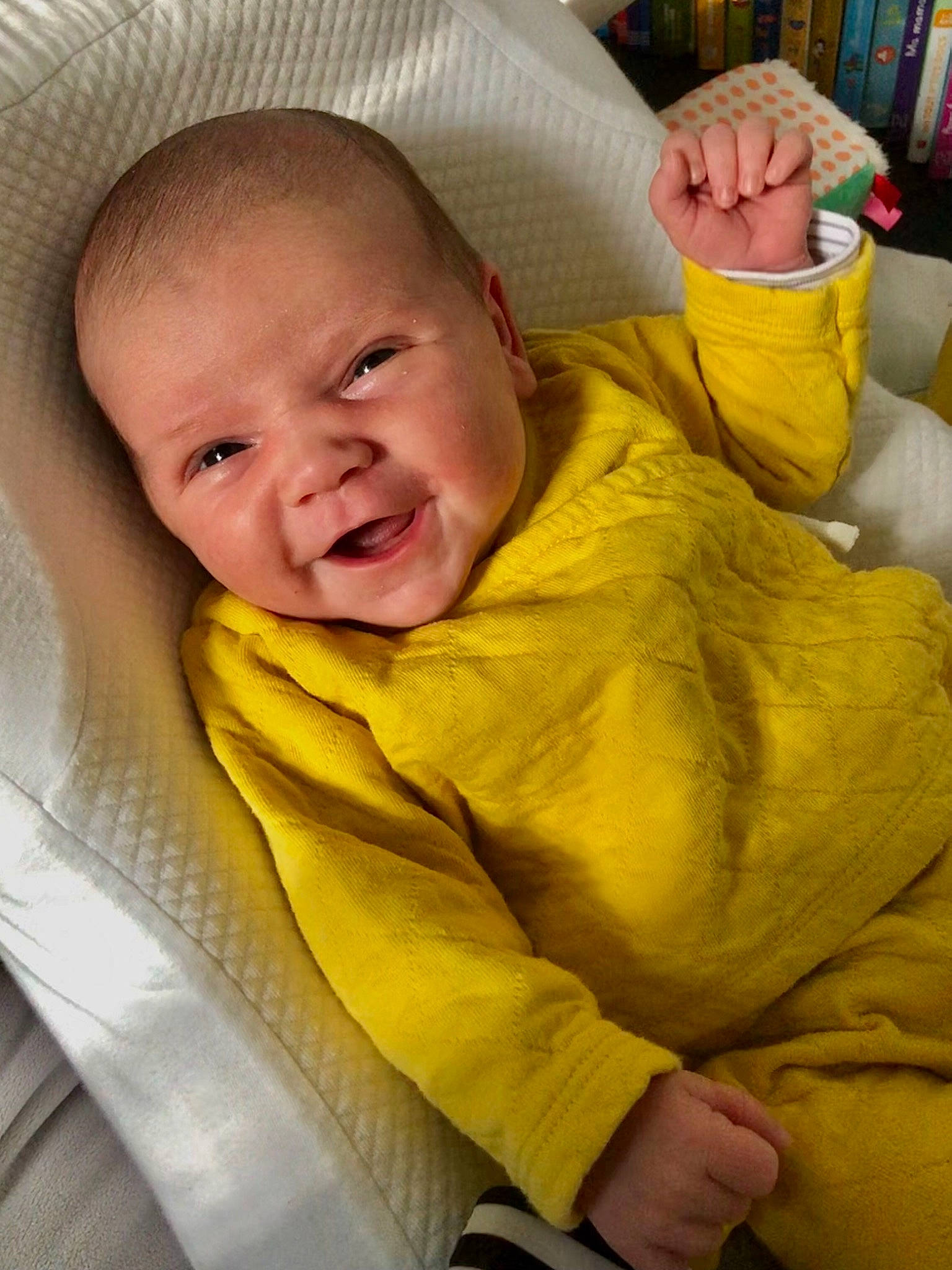 Alba participe au concours pour gagner de l'argent avec cette photo : baby, baby_products, baby_toddler_clothing, bookcase, cheek, comfort, eye, finger, fun, happy, head, iris, linens, mouth, nose, person, skin, sleeve, smile, toddler