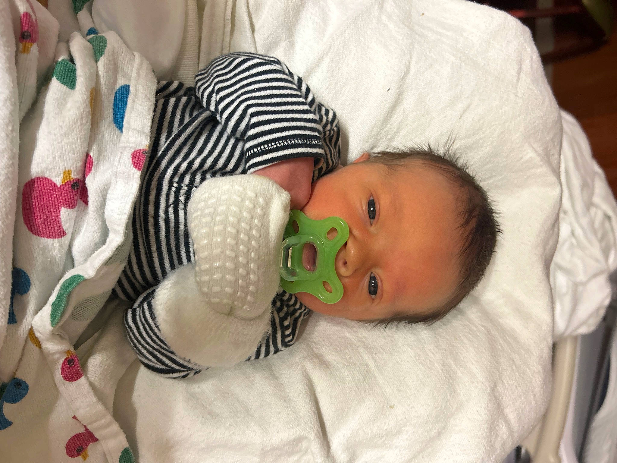 Benson is registered to the contest to win money with this photo: baby, baby_products, baby_safety, baby_toddler_clothing, bedtime, child, comfort, human_body, infant_bed, linens, nose, pattern, person, room, skin, toddler