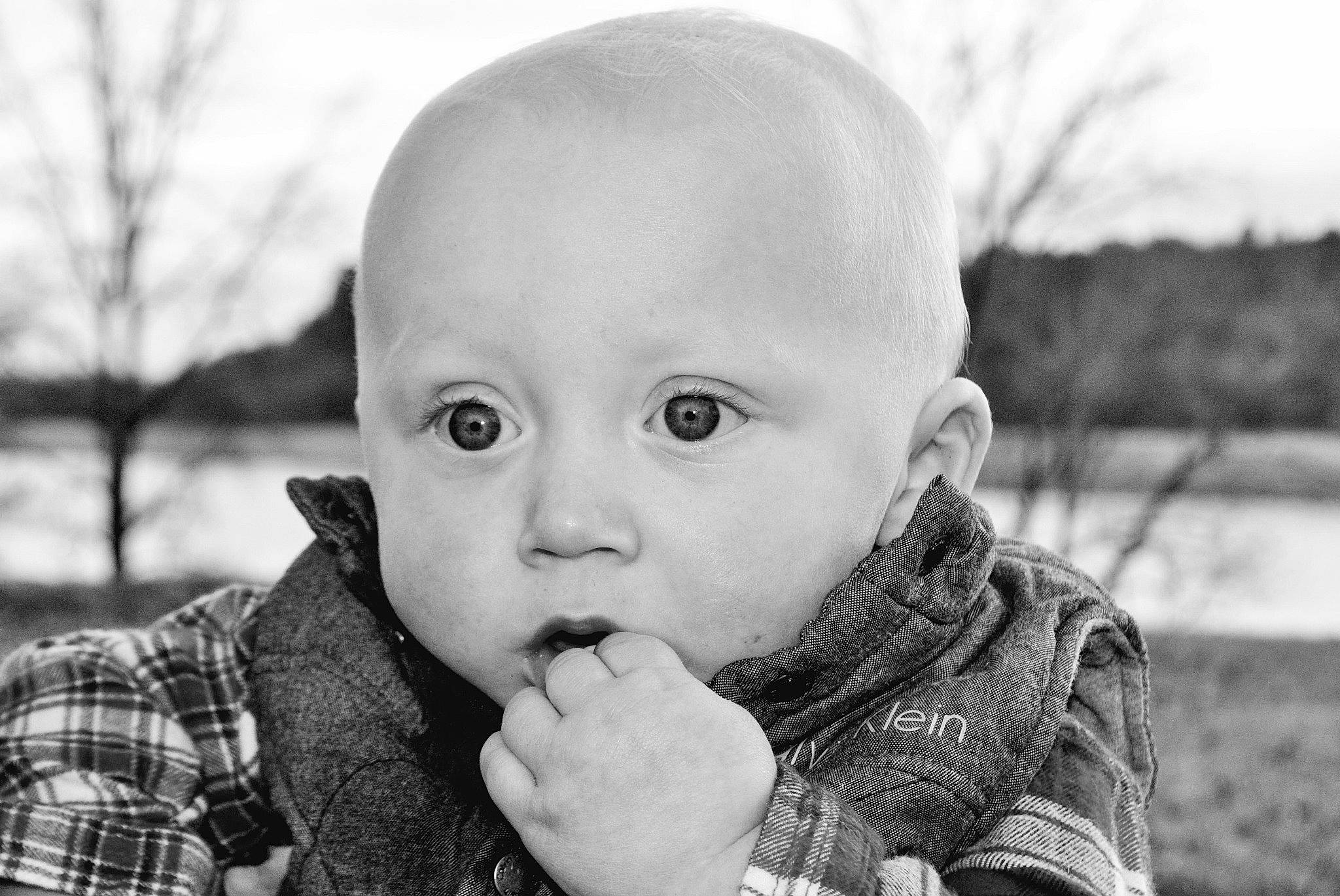 Blaine is registered to the contest to win money with this photo: arm, baby, black_and_white, cheek, eye, face, flash_photography, gesture, grass, hand, happy, head, iris, lip, mouth, nose, person, skin, standing, style