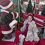 Andra Maria a rejoint le concours — aidez-le/la à gagner de superbes lots ! child, girl, smiling, coat, minnie_mouse_ears, red_dress, white_tights, boots, stuffed_bear, santa_costume, christmas_decorations, gift_box, shopping_mall, festive, holiday, decorative_trees, bench, red_cushion, nutcracker, indoor