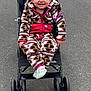 Brynnlee joined the competition — help win amazing prizes! child, toddler, smiling, stroller, outdoor, pavement, clothing, onesie, happy, person, footwear, jacket, blond_hair, baby, sitting, casual, cute, small, young, cozy